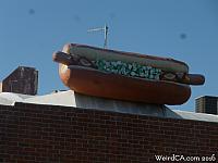 A giant hot dog overlooks a 7-11 on Overland Avenue.