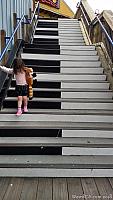 Tiffany walking down the piano staircase on Pier 39